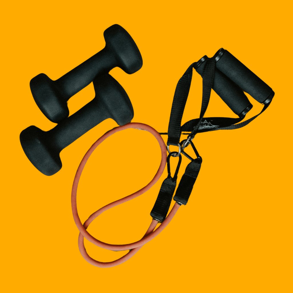 Yellow outline of various fitness products including a massage gun, a hand gripper, and a jump rope on a black background, representing the All Products collection at KangAthletics.